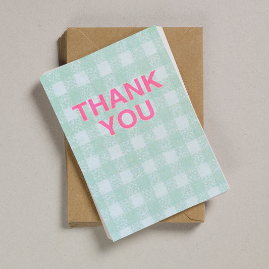 Green gingham card with neon pink lettering